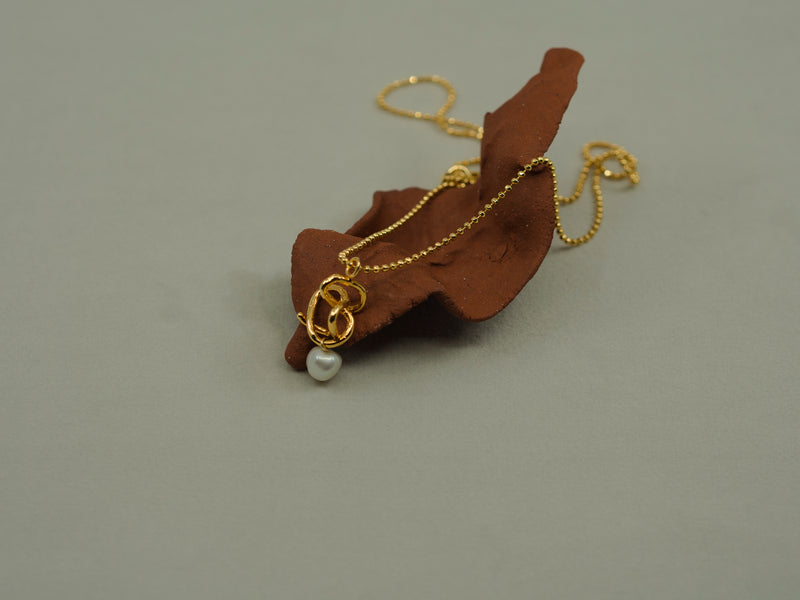 Entwined Gold and Pearl Pendant